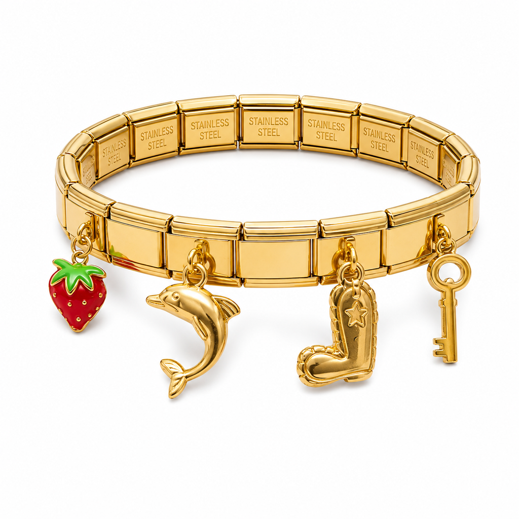 A gold-toned stainless steel stretch charm bracelet with four dangling charms: a red strawberry with green leaves, a dolphin, a cowboy boot with a star, and a key.