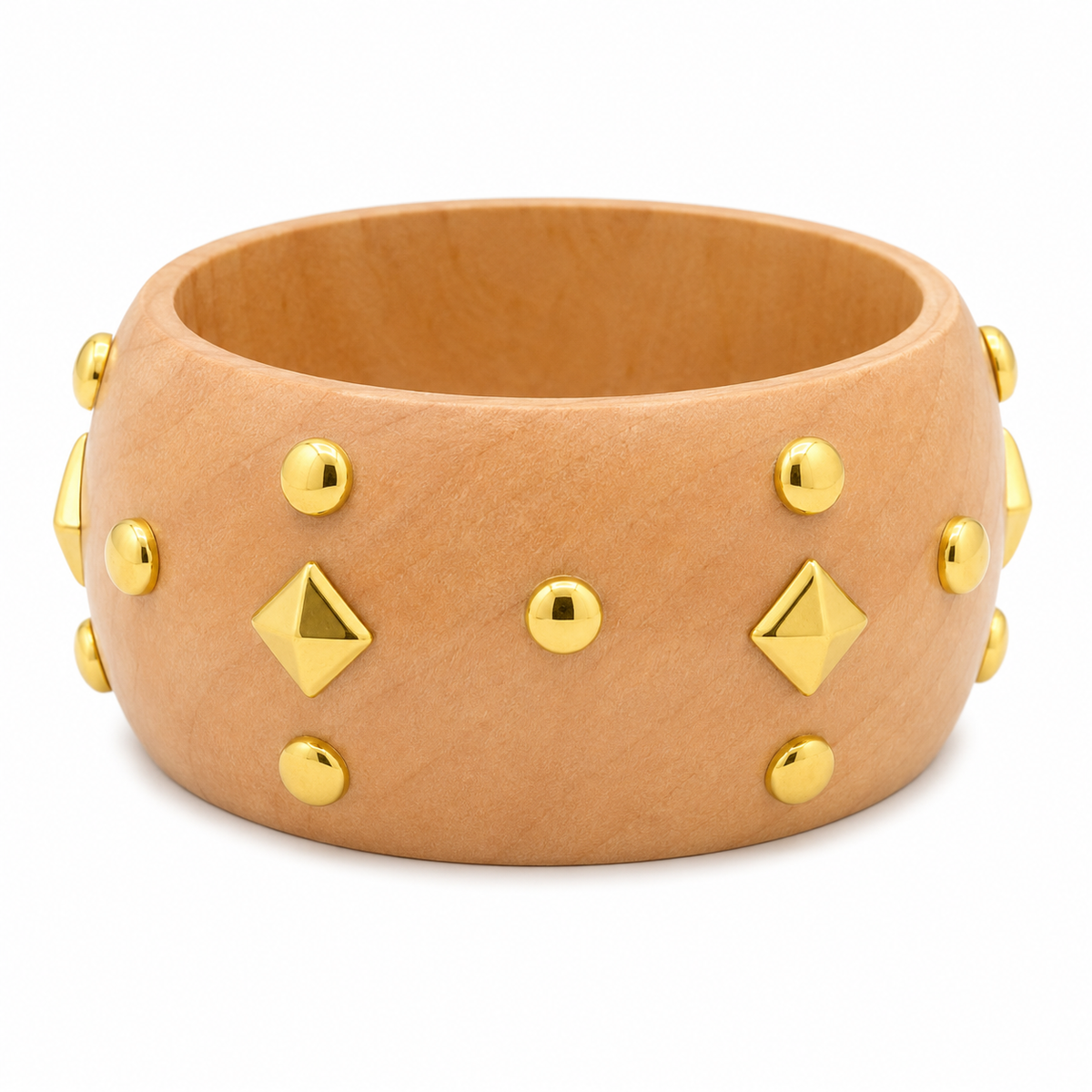 A wide tan leather cuff bracelet decorated with gold-tone metal studs and pyramid-shaped studs, shown on a plain white background.