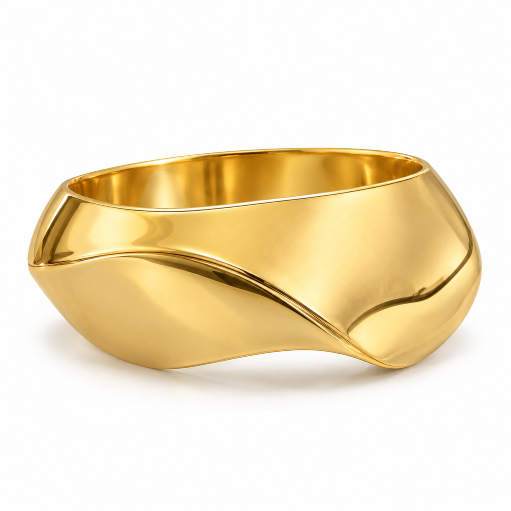 A polished gold wavy bangle bracelet on a clean white background.