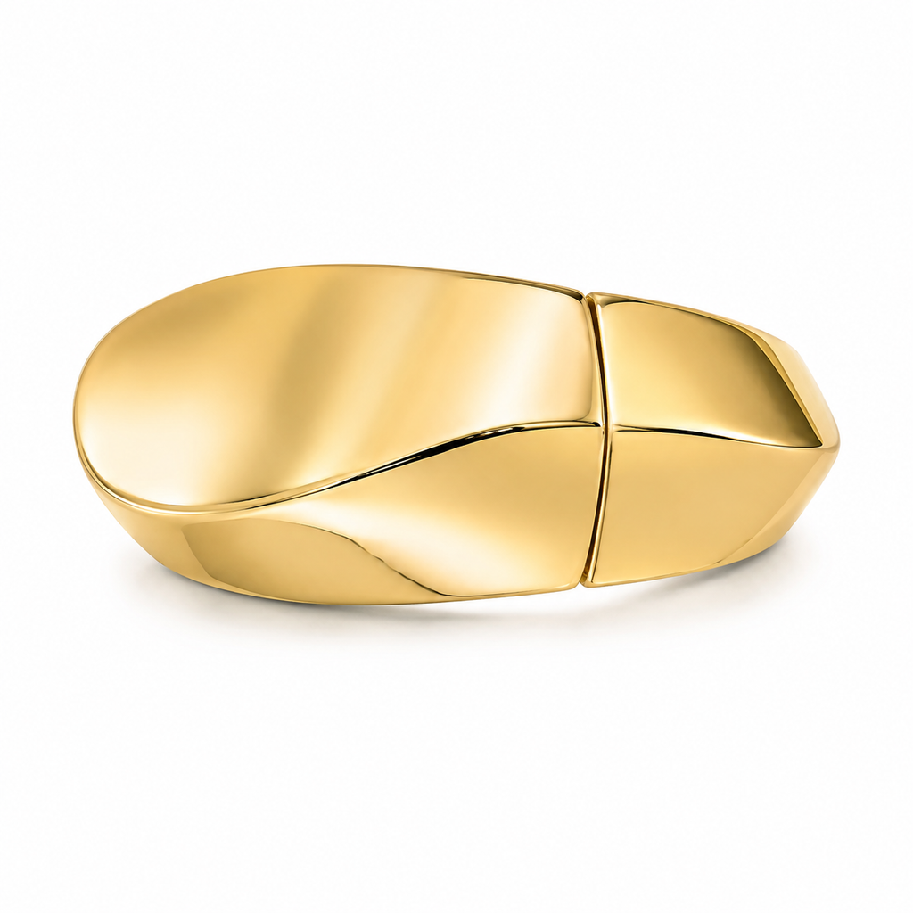 A polished gold capsule-shaped ring with a smooth, reflective finish, shown on a clean white background.