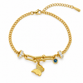 A gold chain bracelet with a butterfly charm, a small blue gemstone, and clear crystal accents, shown on a plain white background.