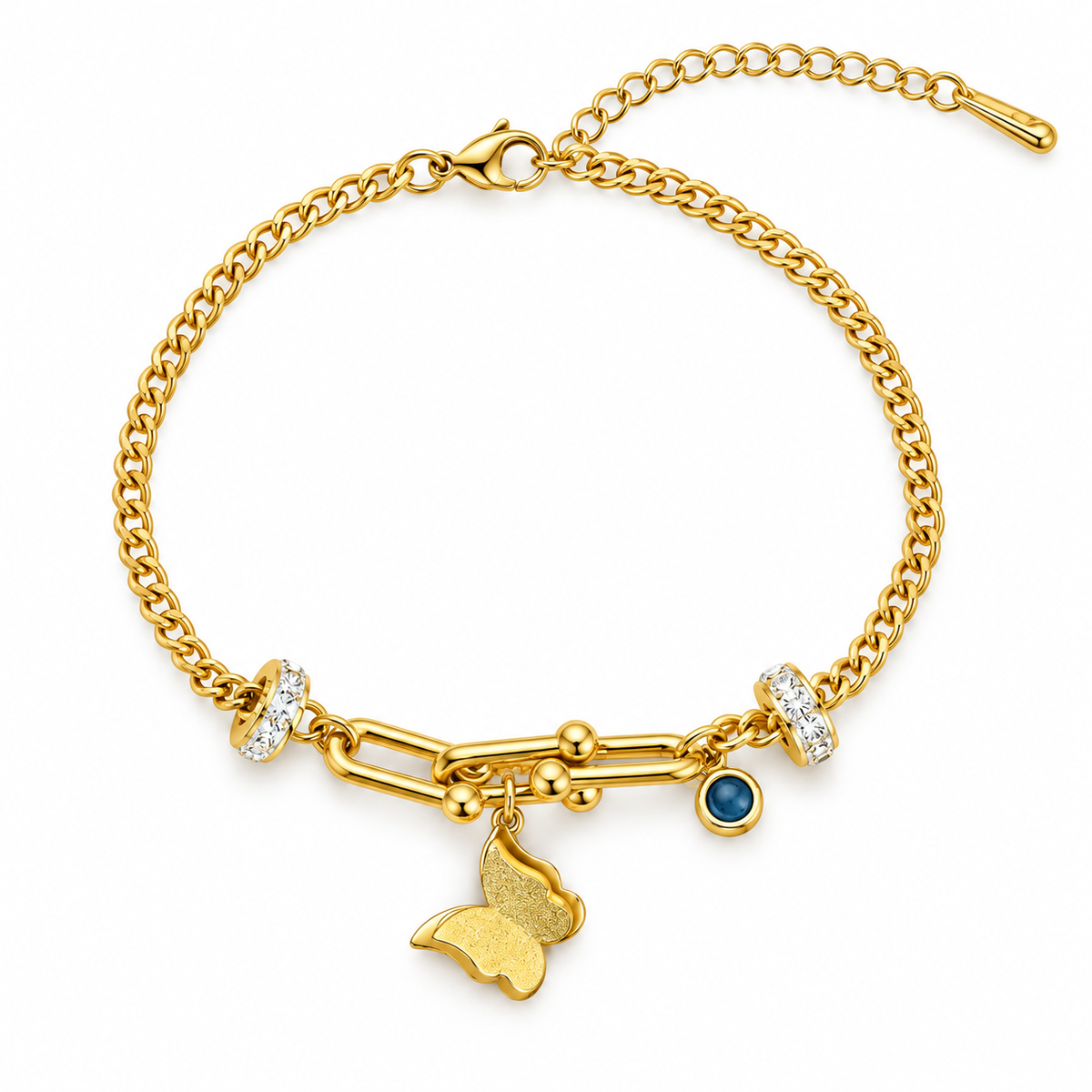 A gold chain bracelet with a butterfly charm, a small blue gemstone, and clear crystal accents, shown on a plain white background.