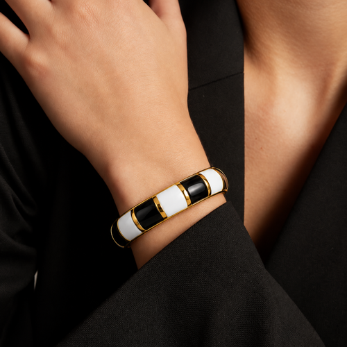 Elegant two-tone bracelet with glossy black and white enamel design