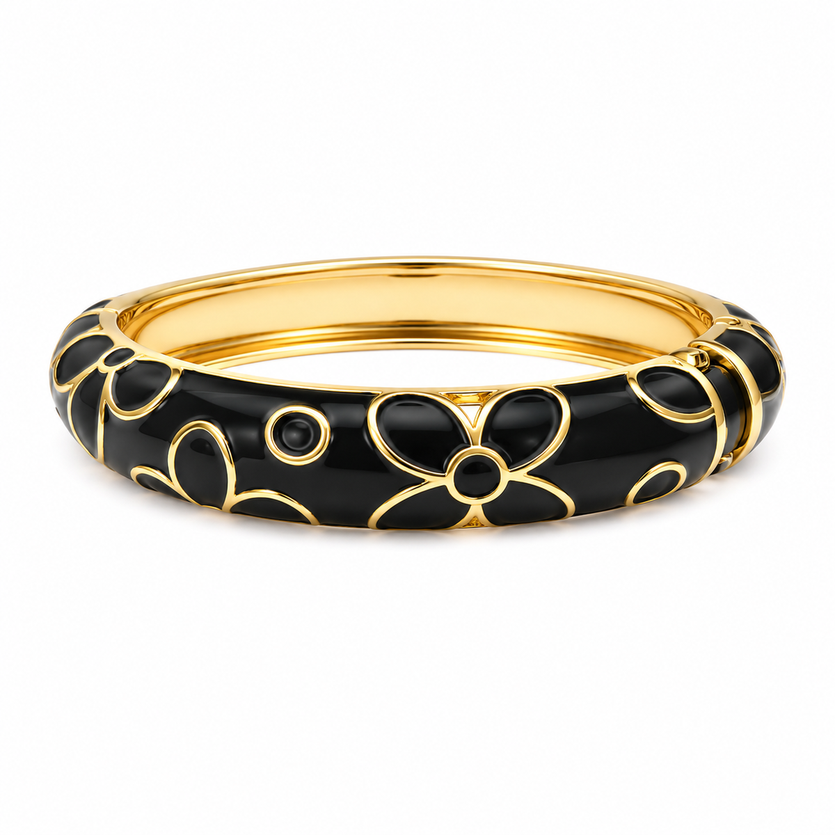 A gold-plated bangle bracelet with a glossy black enamel floral pattern, shown on a clean white background.
