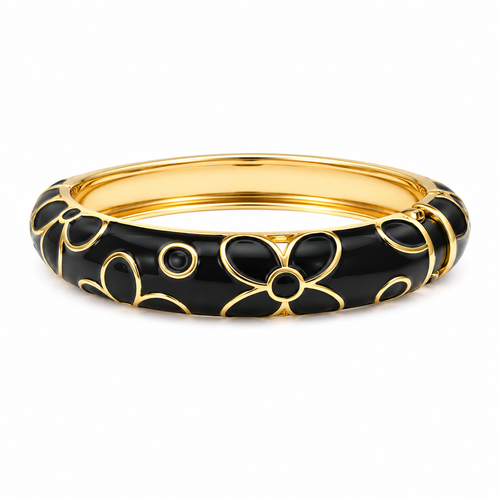 A gold-plated bangle bracelet with a glossy black enamel floral pattern, shown on a clean white background.