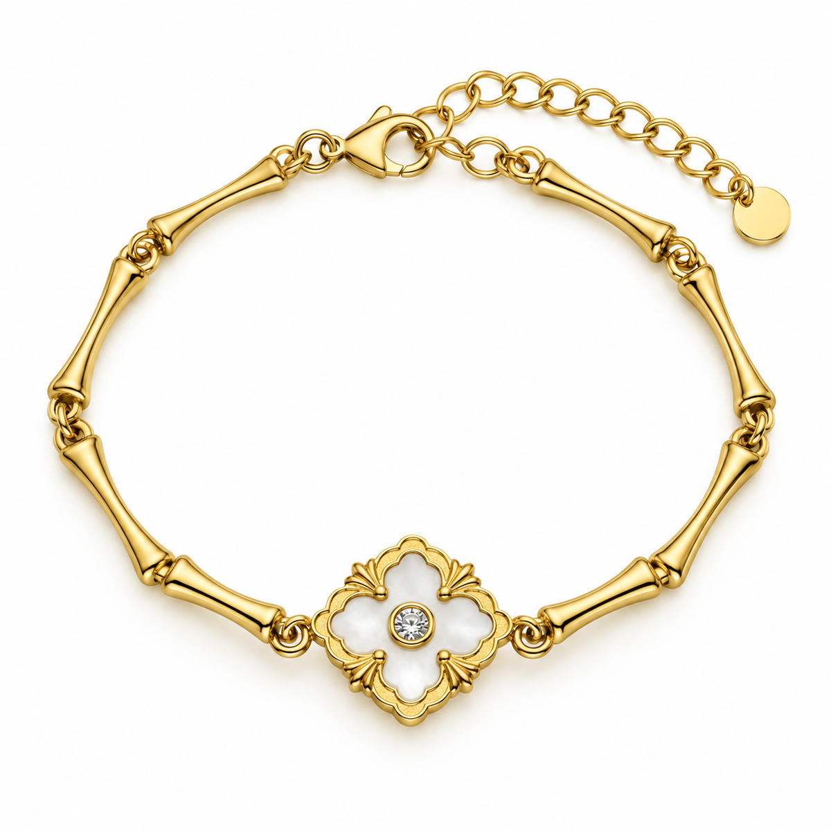 A gold bracelet featuring a bamboo-inspired link design and a central clover-shaped motif with a white inlay and a small clear gemstone, shown on a plain white background.