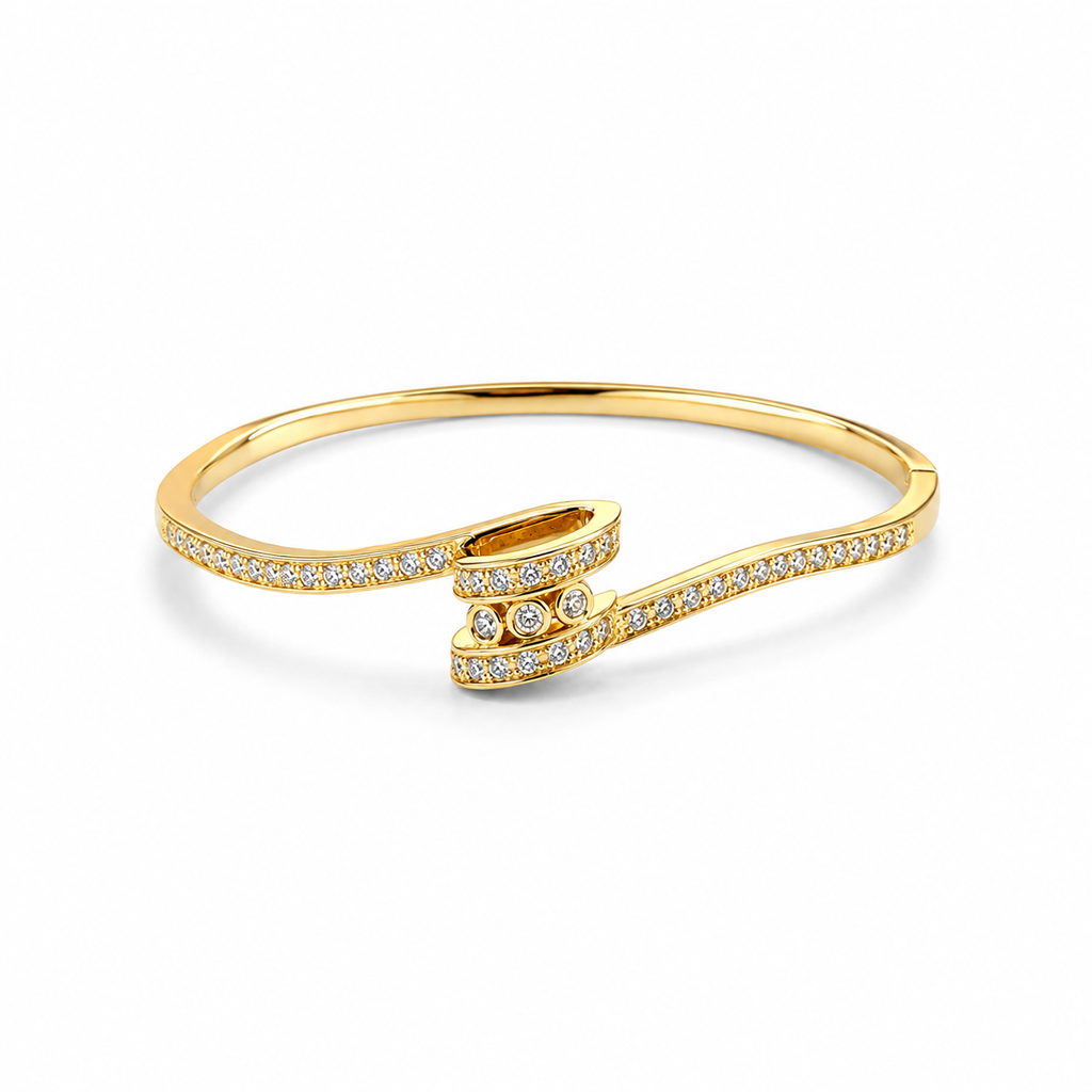 A gold wrap-style bangle bracelet adorned with pavé-set clear stones, shown on a clean white background.