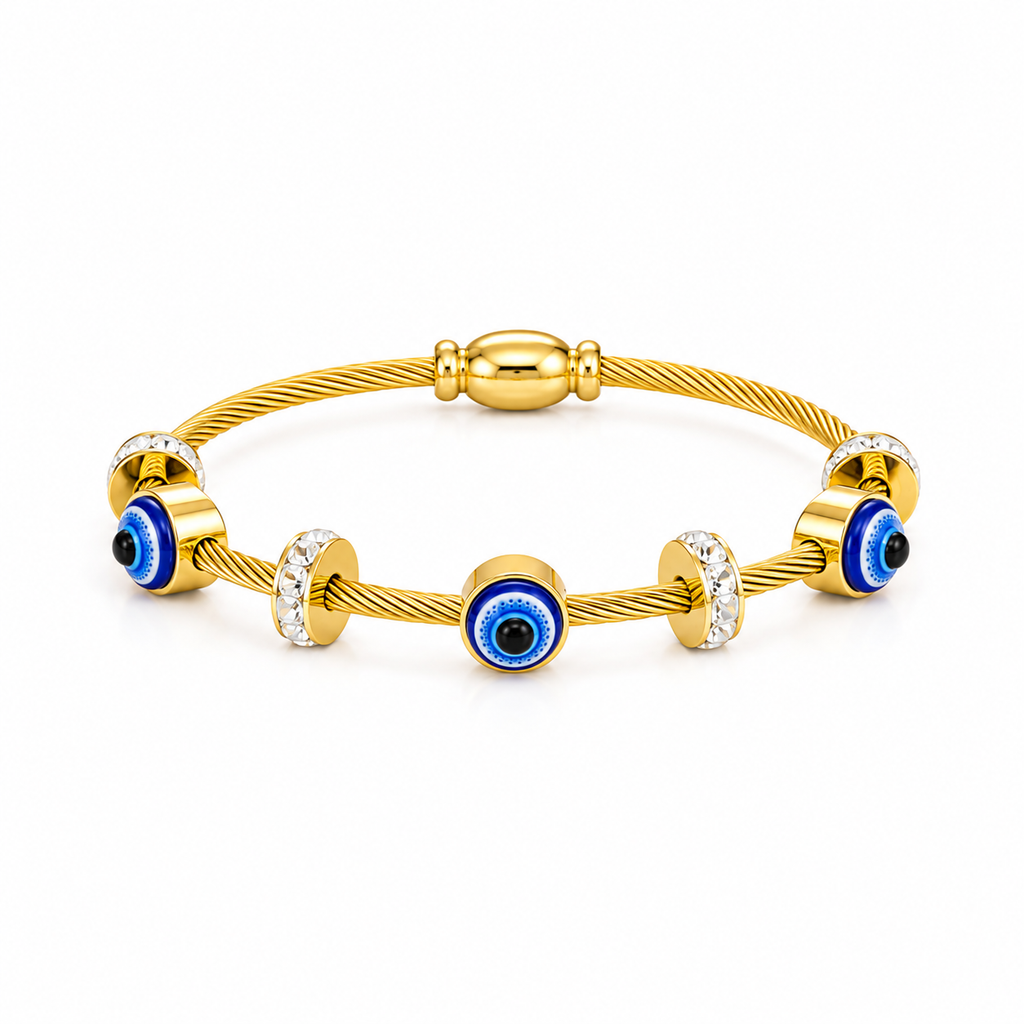 A gold cable-wrapped bracelet with evil eye charms and clear crystal accents, photographed on a clean white background.