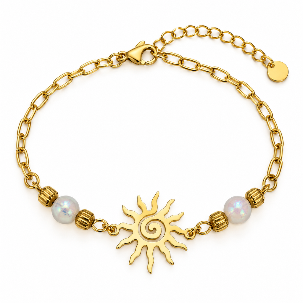 A gold chain bracelet featuring a central sunburst charm, two white iridescent beads, and textured gold spacer beads, shown on a plain white background.
