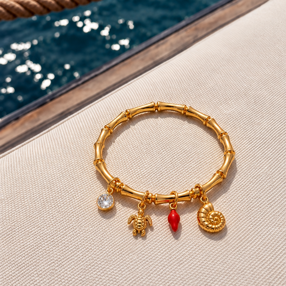 Ocean-inspired kada bracelet for women with turtle, red coral and seashell charms