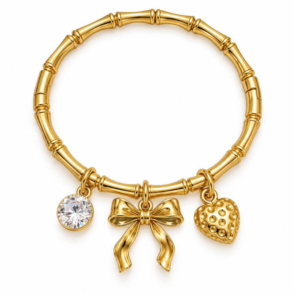 Gold bow charm kada bracelet with CZ accent and heart charm