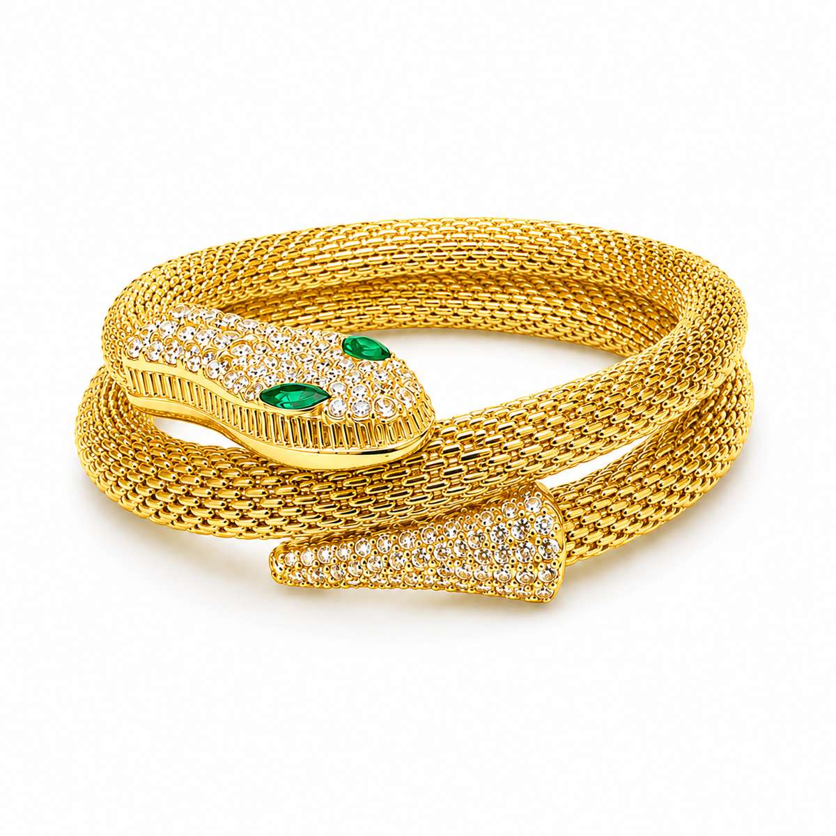 A gold snake bracelet featuring a textured mesh body, a head pavé-set with clear stones, and two green emerald-cut eyes, shown on a white background.