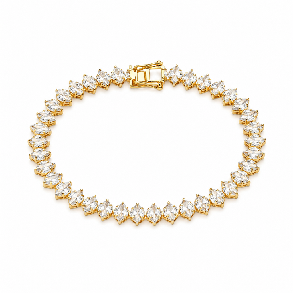 A yellow gold tennis bracelet featuring marquise-cut clear gemstones in a continuous link design, displayed on a clean white background.