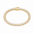 A yellow gold tennis bracelet featuring marquise-cut clear gemstones in a continuous link design, displayed on a clean white background.