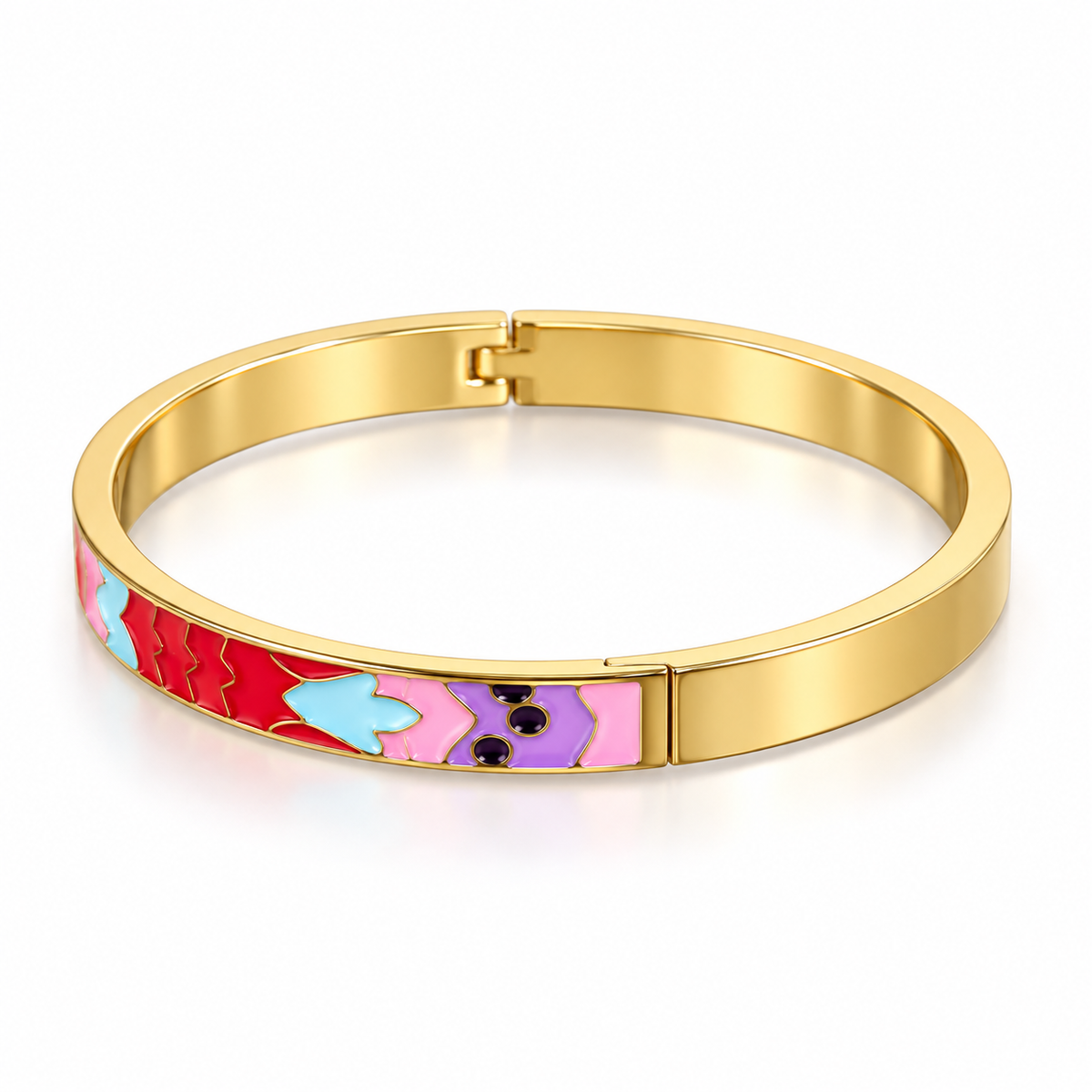 A gold-plated bangle bracelet with a colorful enamel heart pattern in red, light blue, pink, and purple on the front band, shown on a clean white background.