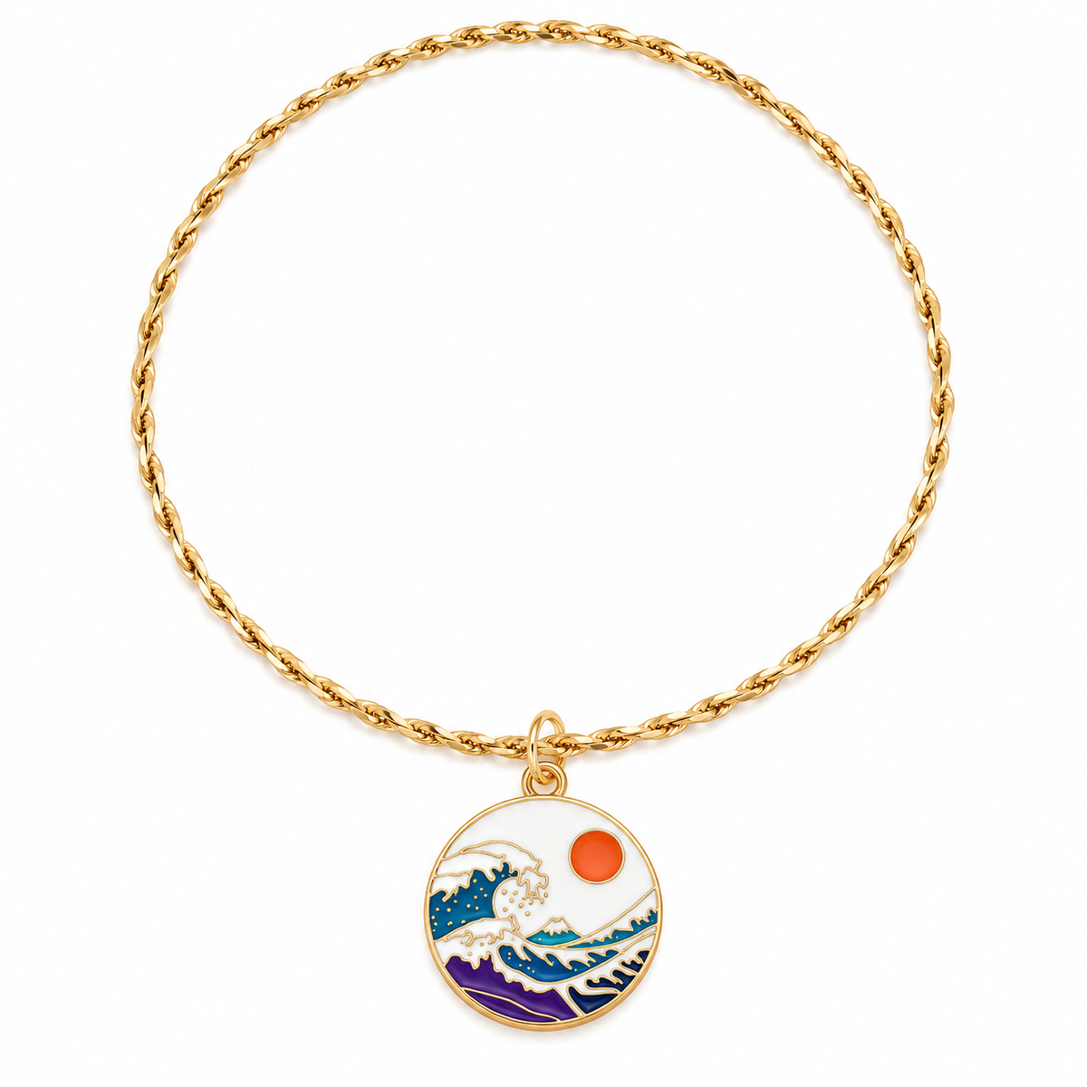 A gold chain bracelet with a circular pendant featuring an enamel-style print of Mount Fuji and the rising sun in blue, purple, white, and orange.