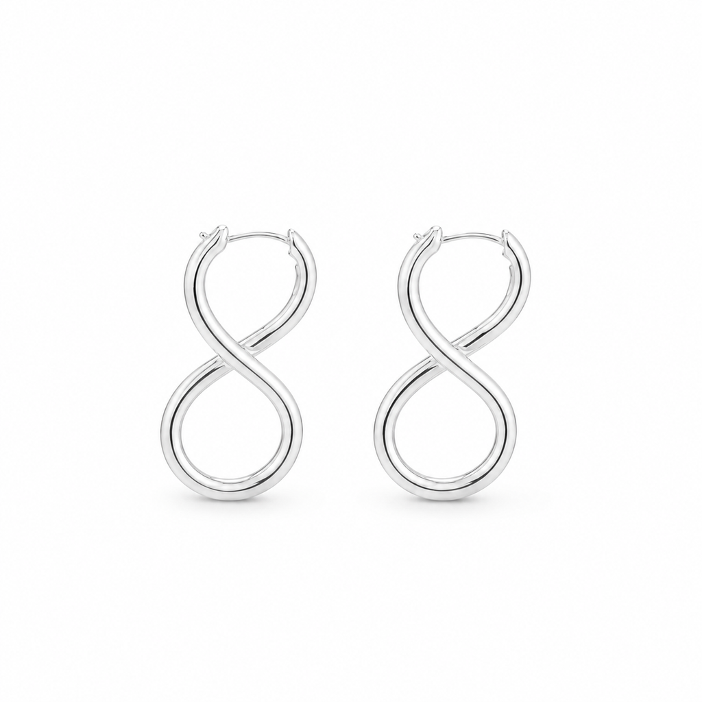 A pair of polished silver infinity-shaped hoop earrings on a clean white background.