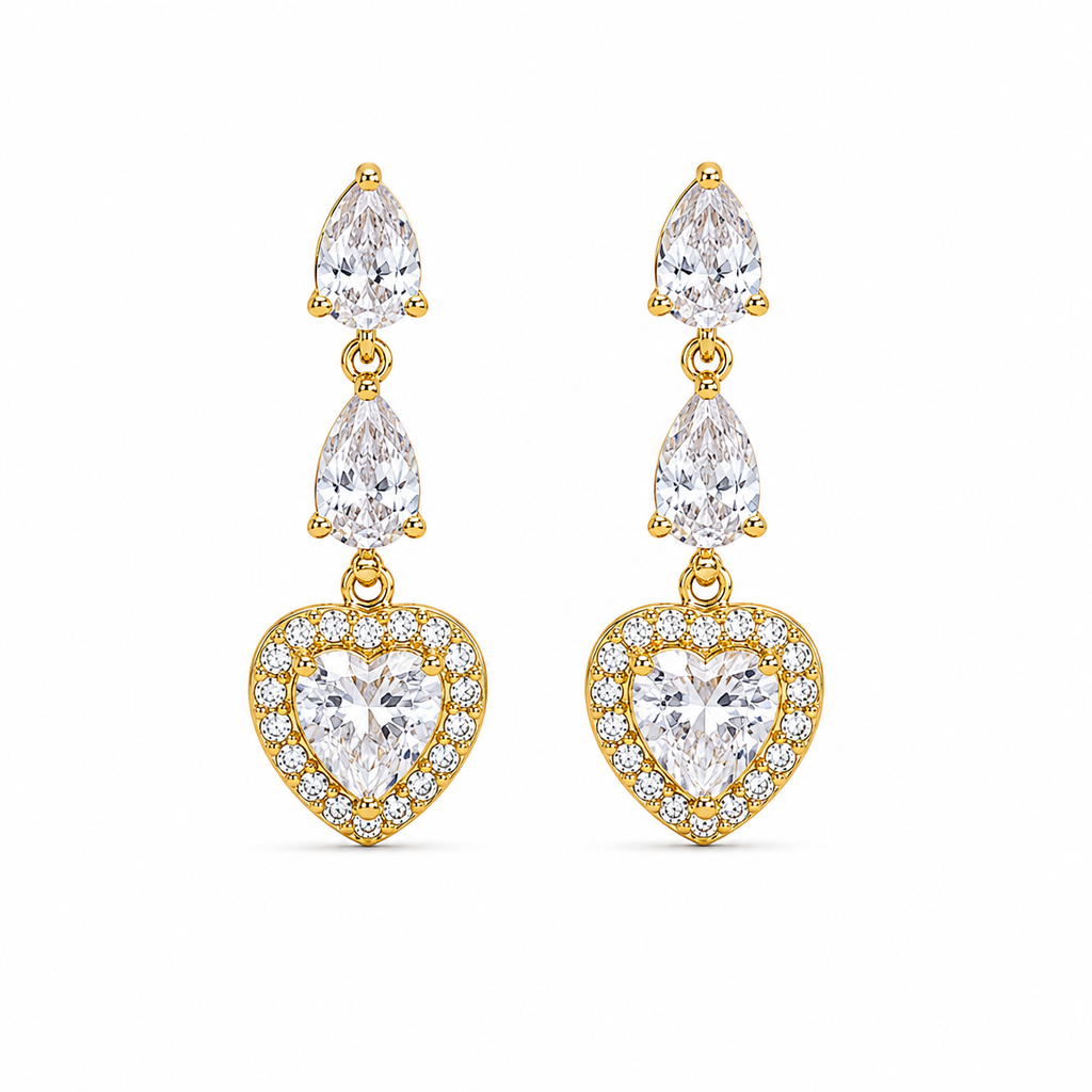 A pair of gold drop earrings featuring pear-cut and heart-cut clear crystals, set in yellow gold with small accent stones, shown against a plain white background.