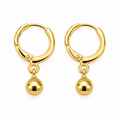 A pair of gold hoop earrings with a small dangling ball charm, shown on a plain white background.