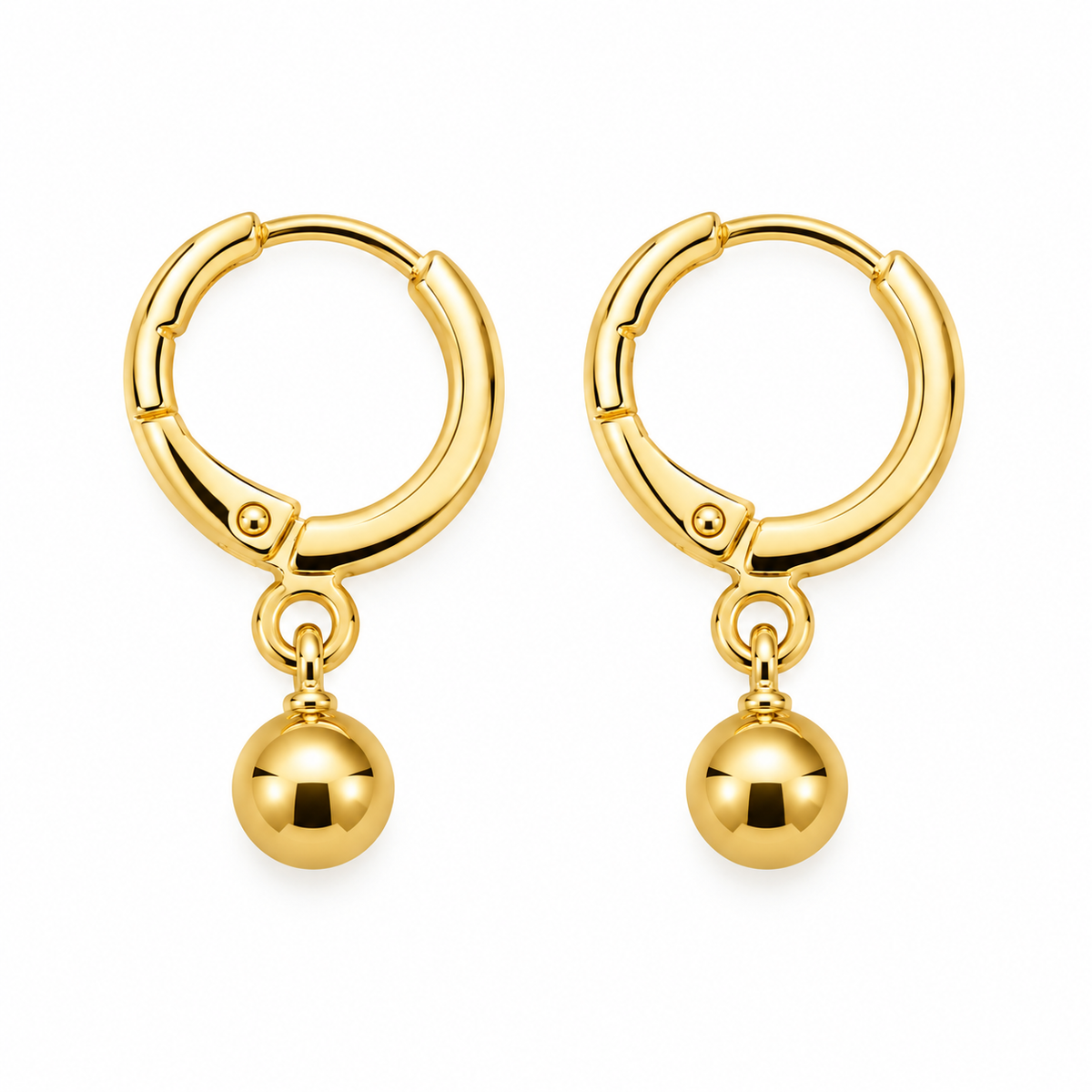 A pair of gold hoop earrings with a small dangling ball charm, shown on a plain white background.