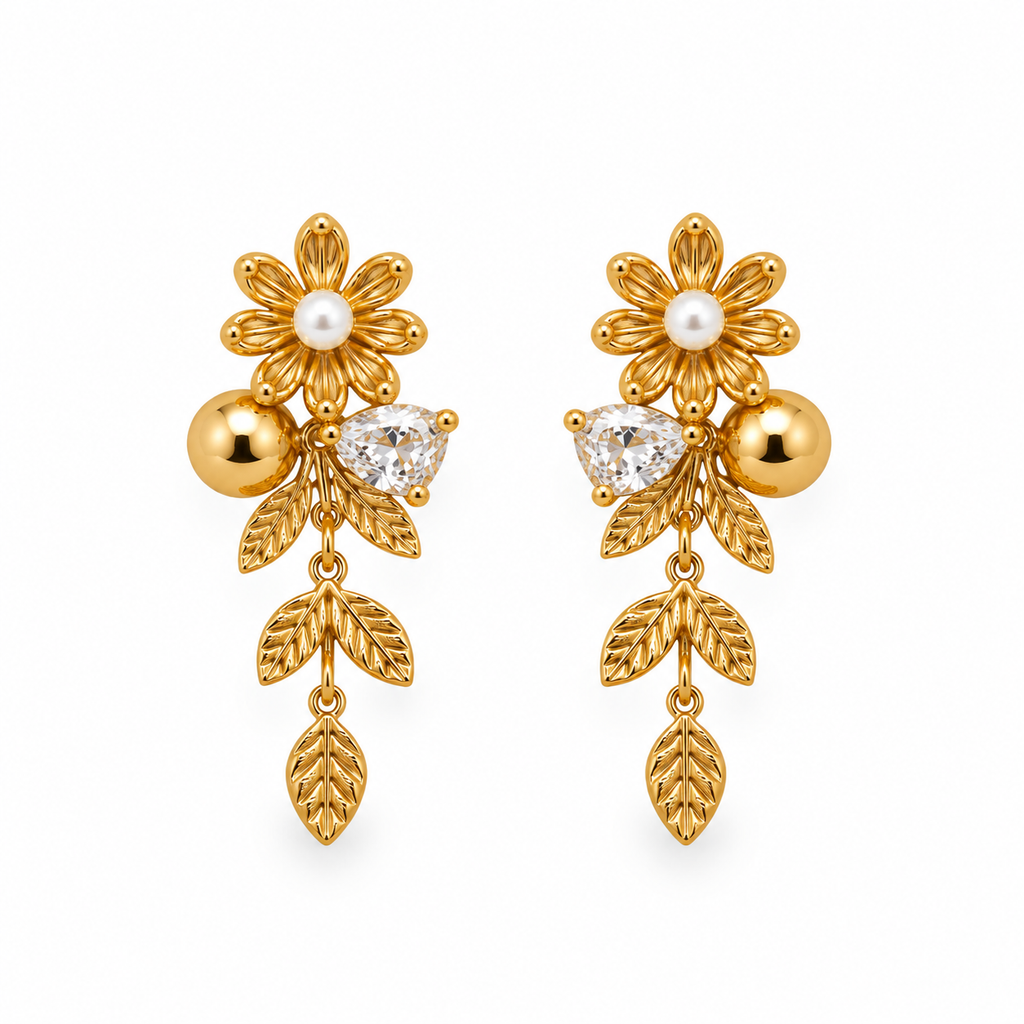 A pair of gold floral drop earrings with pearl centers, clear marquise-cut stones, and gold beads, shown on a plain white background.