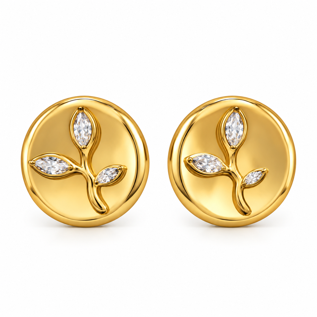 A pair of gold round stud earrings featuring a raised leafy branch motif with three marquise-cut clear gemstones, shown on a clean white background.