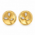 A pair of gold round stud earrings featuring a raised leafy branch motif with three marquise-cut clear gemstones, shown on a clean white background.