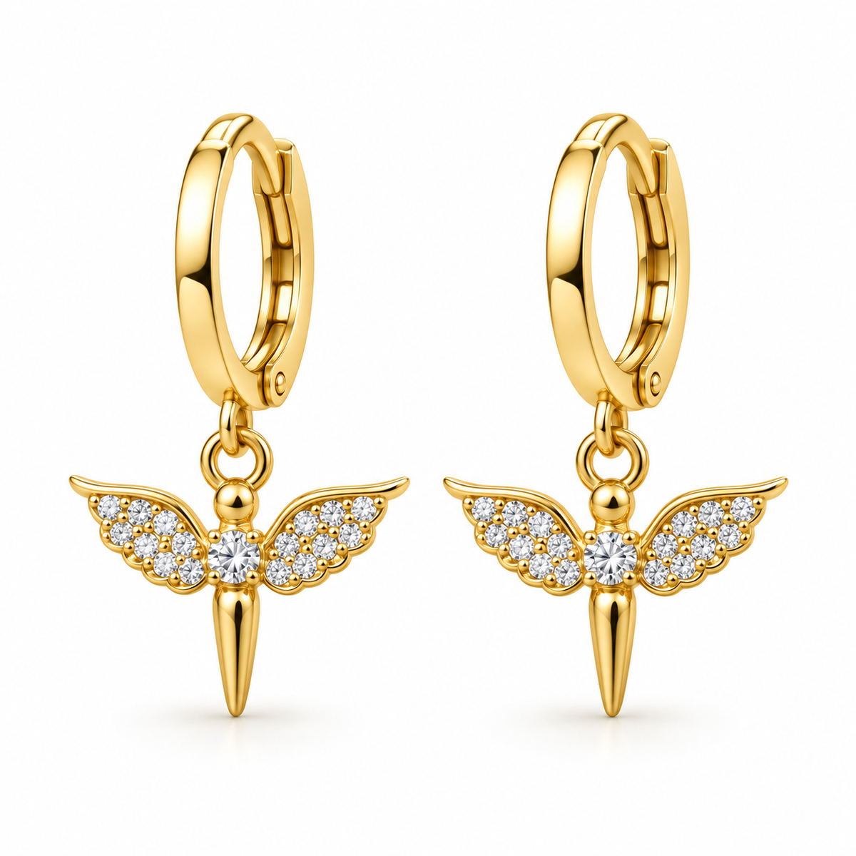 A pair of gold huggie hoop earrings with dangling angel wing charms. The charms feature gold-plated wings paved with small clear cubic zirconia stones, with a central round stone and a pointed gold tail hanging below.