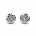 A pair of round silver stud earrings featuring a textured five-petal flower design with a small clear center stone, set against a plain white background.