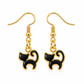 A pair of gold-tone dangle earrings featuring black cat-shaped charms outlined in gold, shown on a plain white background.