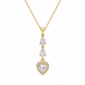 A gold dangle necklace featuring a heart-shaped pendant surrounded by small clear stones, with two pear-cut stones above on a delicate chain, set against a plain white background.
