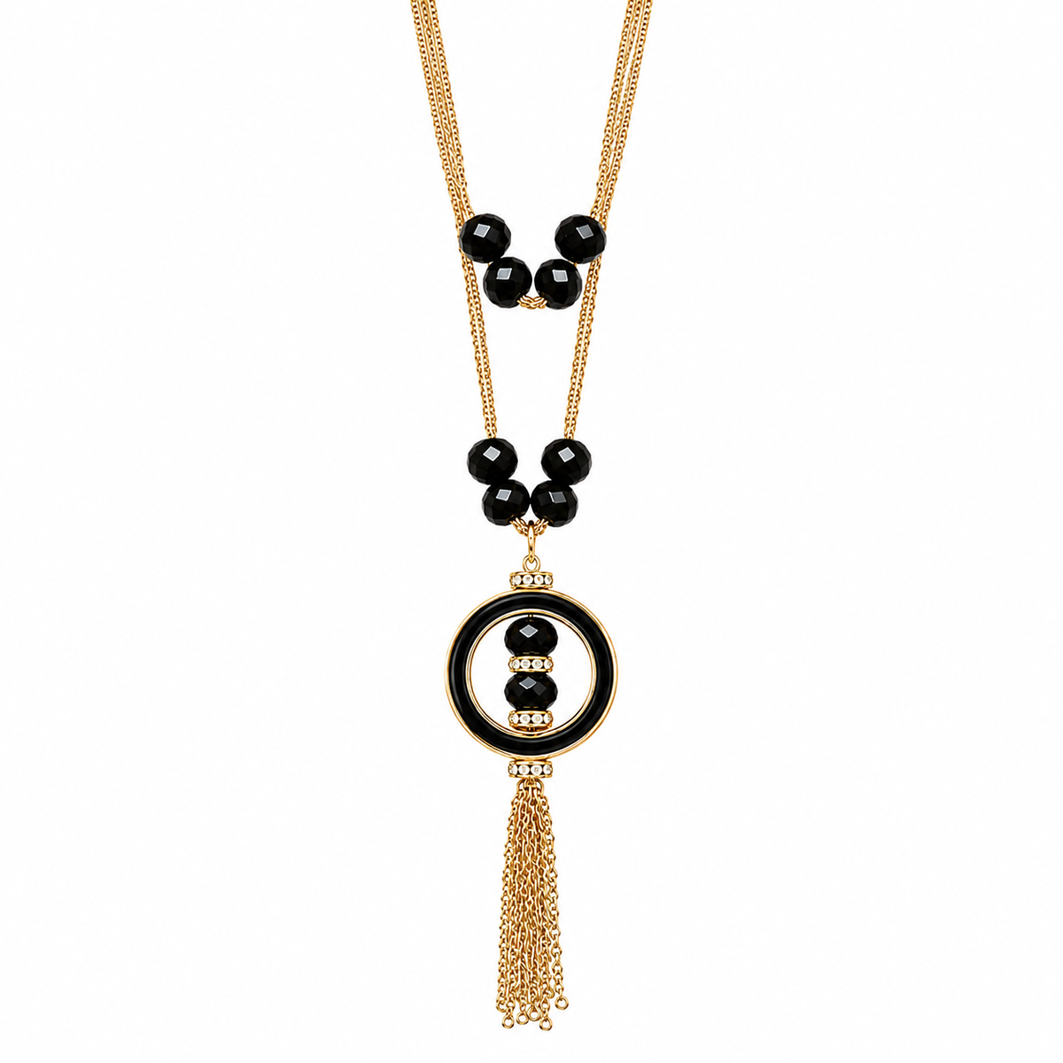A gold-tone and black beaded necklace featuring a circular pendant with a central black bead, flanked by small gold beads, and finished with a dangling gold-tone tassel chain, shown on a plain white background.