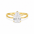 A pear-cut diamond ring set in a yellow gold band with a split shank design, shown on a clean white background.
