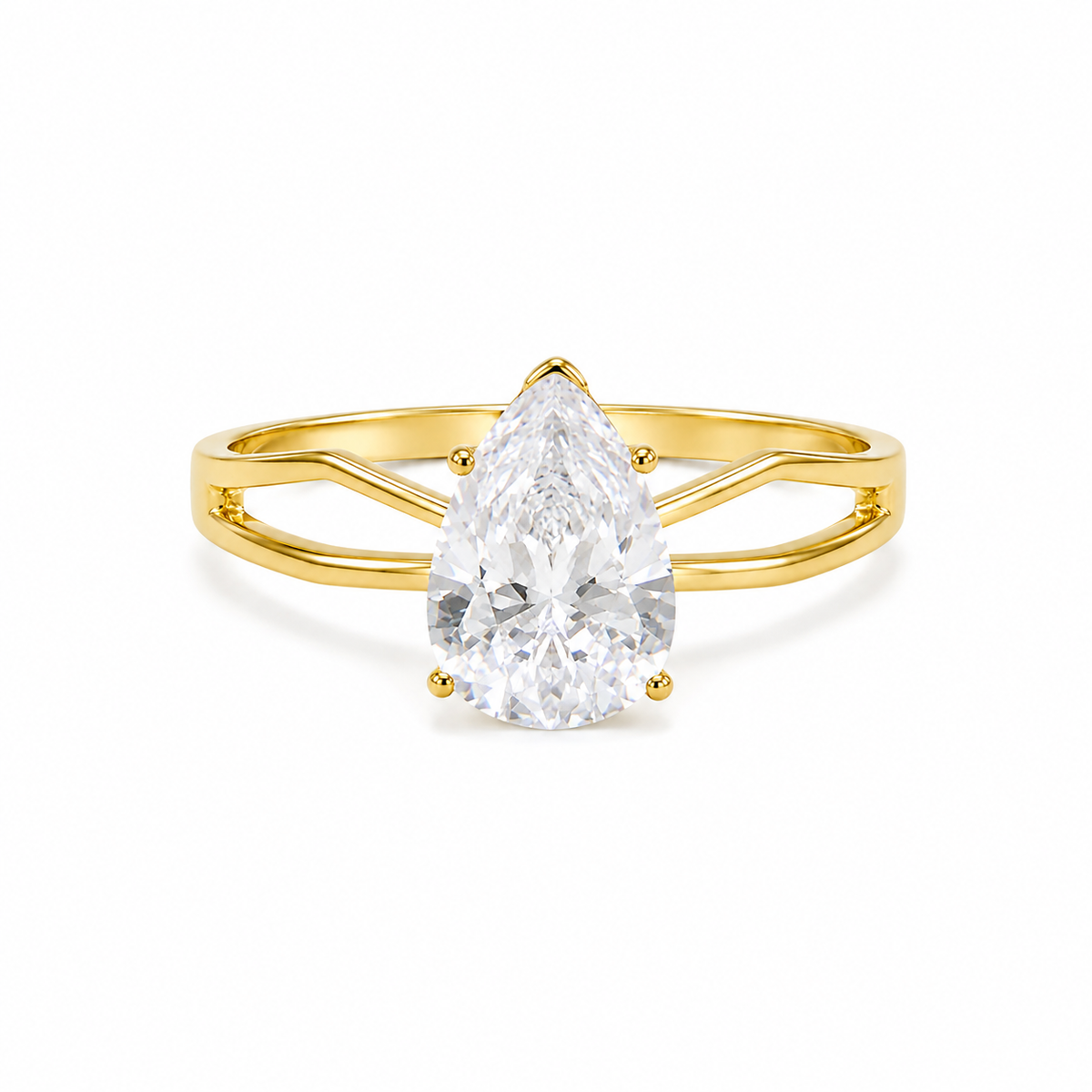 A pear-cut diamond ring set in a yellow gold band with a split shank design, shown on a clean white background.