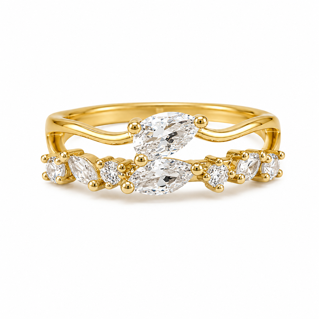 A yellow gold ring with marquise-cut clear gemstones, shown on a clean white background.