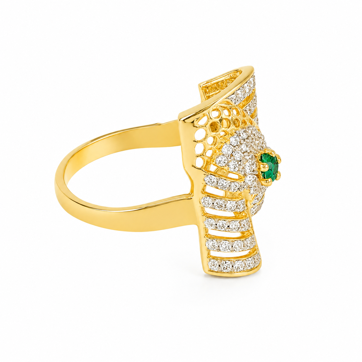 A gold ring featuring a stylized bird design paved with small clear stones and accented by a round green emerald on the side, shown on a plain white background.