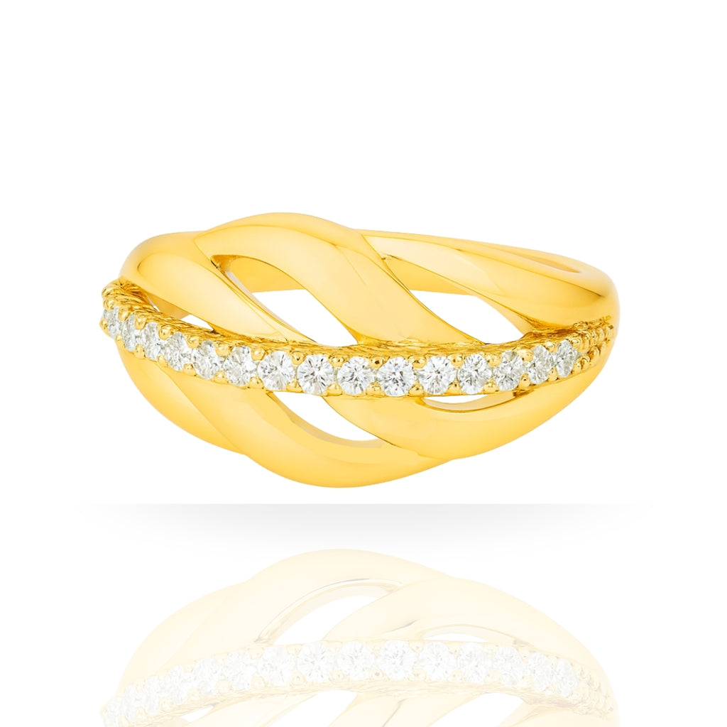 A yellow gold ring with a twisted, overlapping band design and a horizontal row of clear pavé-set round diamonds, shown on a white background with a soft reflection below.